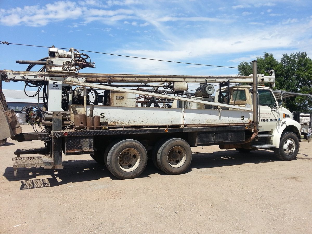 Water well drilling rig set up on location